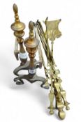A pair of fire dogs, and a set of brass fire side