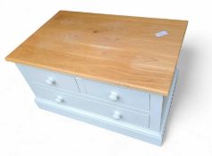 A light grey lacquer TV unit, with light oak top,