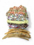 A collection of vintage ladies clothing, mostly dr