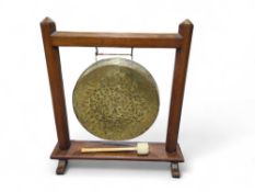 An oak and mahogany framed dinner gong, the frame