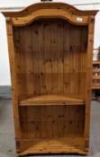 A modern pine bookcase, with four adjustable shelv