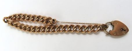 A 9ct rose gold hollow curb link bracelet, each li