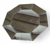 A modern octagonal mirror, with mirrored panel fra