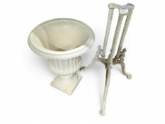 A cream painted heavy metal (probably iron), urn p