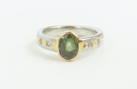 A contemporary 18ct yellow gold and platinum, gree