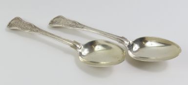 A pair of Georgian silver serving spoons, shell pa