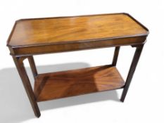 An early 20th century mahogany two tier side table