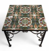 A modern tile top coffee table, on a black metal b