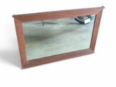 An oak framed wall mirror, 56.5cm x 87cm; together