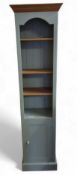 A slim light blue painted and oak unit, the open t