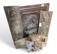 A dark oak door panel, carved in relief with decor