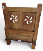 A pair of Arts & Crafts oak framed single beds