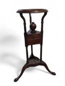A George III mahogany washstand on tripod support