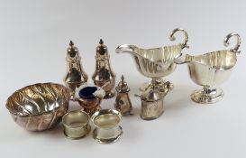 A silver pepper by Walker & Hall, a silver lidded