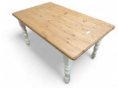 A pine scrub top table on turned supports 76cms hi