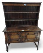 A circa 1930s/'40s oak dresser with shelved top