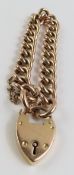 A 9ct rose gold hollow curb link bracelet with hea