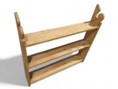 A pine bookshelf, 92cms high max 93cms wide