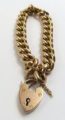 A 9ct gold hollow curb link bracelet with heart pa