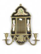 A decorative girandole having pottery panels paint