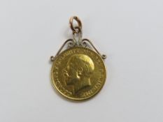 A George V 1915 full sovereign, with a soldered mo