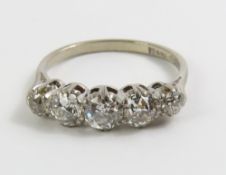 An 18ct white gold old cut diamond graduated five
