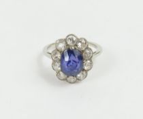 An early 20th century violet colour change sapphire and diamond cl