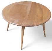 An Ercol drop leaf coffee table upon three (extend