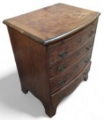 A small chest of four long drawers and a brush, wi