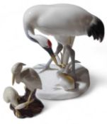 A Noritake figure of a crane with chick, 17cms hig