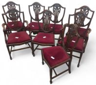 A set of eight stained dining chairs (six chairs