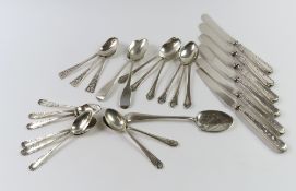 A small collection of silver flatware, comprising teaspoons and silver handled