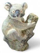 A Royal Copenhagen figure of a koala bear on a tre