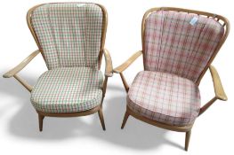 Two Ercol armchairs with cushions and attacha