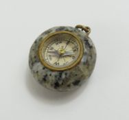 A miniature granite compass charm, 2.5cm long incl