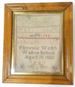 A Victorian sampler worked in coloured thread with