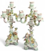 A pair of Meissen style four branch candela