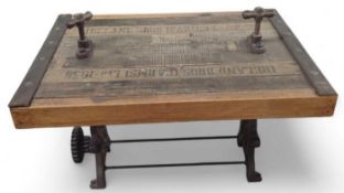 A vintage style wood and metal coffee table with a