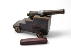 A model of a cannon, the bronze cannon mounted on