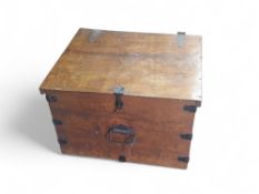 A metal bound stained wood box with hinged lid and