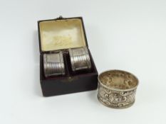 A pair of silver napkin rings, in fitted presentation case,