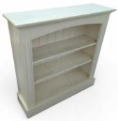 A white painted pine bookshelf of two adjustable s