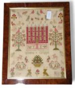 A woolwork sampler worked with stylised trees, ani