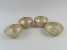 A pair of bowls with floral decoration, together w