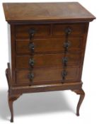 A veneered table top apprentice chest on stand, wi