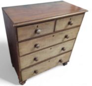 A 20th century mahogany chest of two short and thr