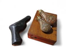 Two small embossed brass shot flasks, a leather fl