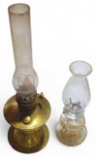 An oil lamp with moulded glass reservoir together