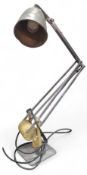 An early angle poise lamp with cream painted base