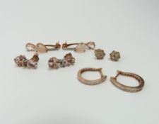 A pair of 9ct rose gold white stone set hoop earri